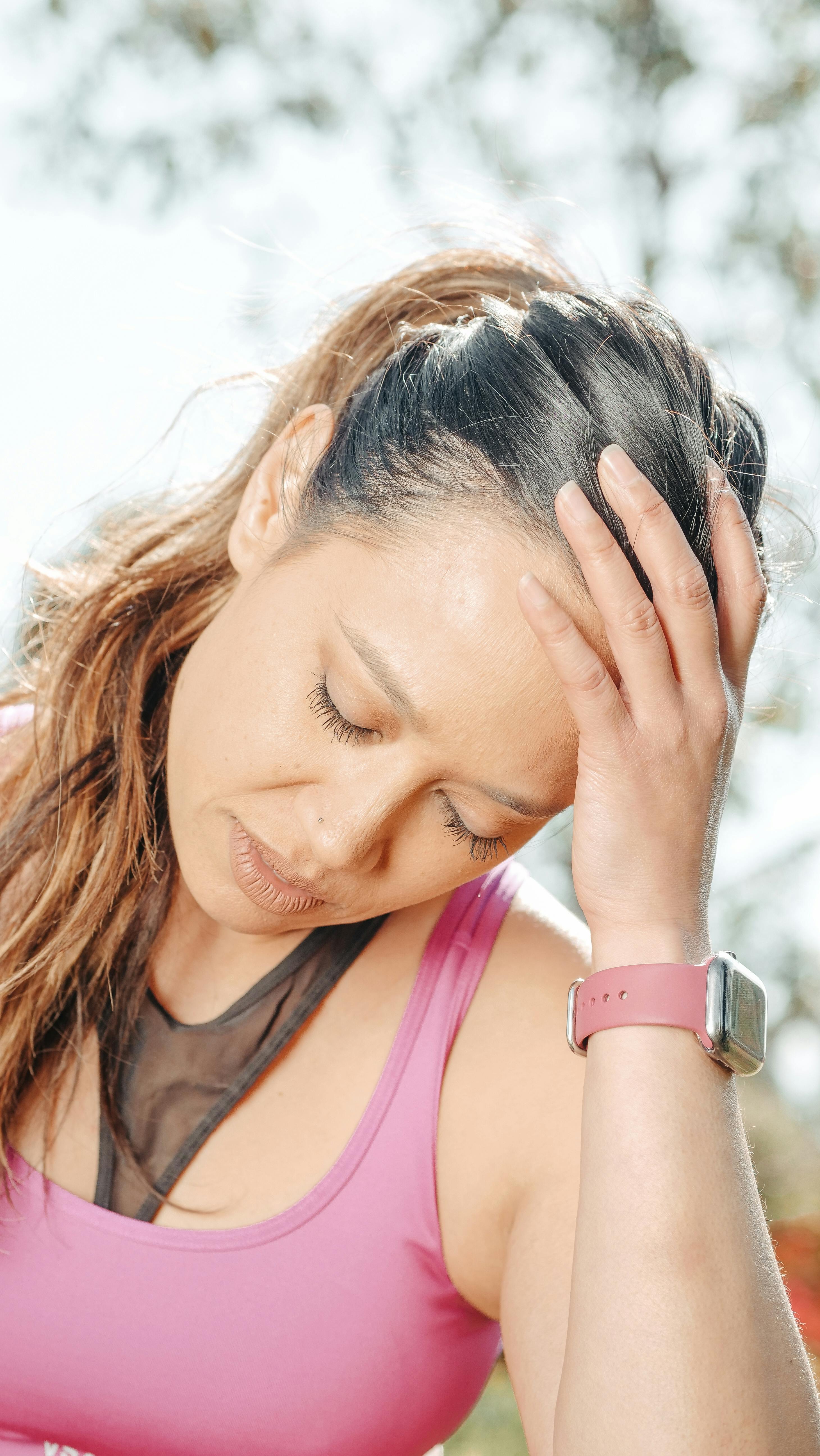 Patient experiencing headache symptoms in a quiet exam space